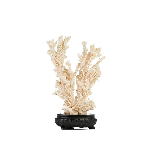 94 - A Chinese mottled pink/white coral carving in the form of a flowering prunus tree, 20th century, wit... 