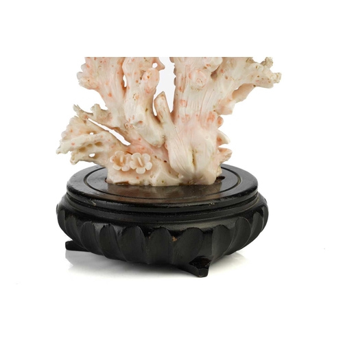 94 - A Chinese mottled pink/white coral carving in the form of a flowering prunus tree, 20th century, wit... 