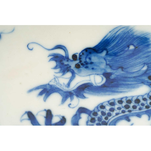 95 - A Chinese porcelain blue & white dragon bowl, the interior with a single writhing dragon, the exteri... 