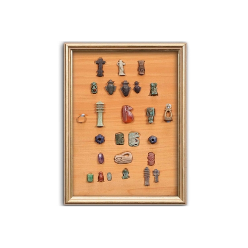 99 - A Collection of Ancient Egyptian artefacts including a bronze Djed pillar amulet, agate Tawaret amul... 