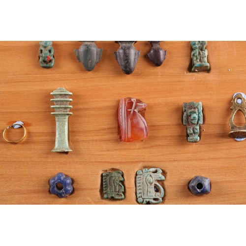 99 - A Collection of Ancient Egyptian artefacts including a bronze Djed pillar amulet, agate Tawaret amul... 