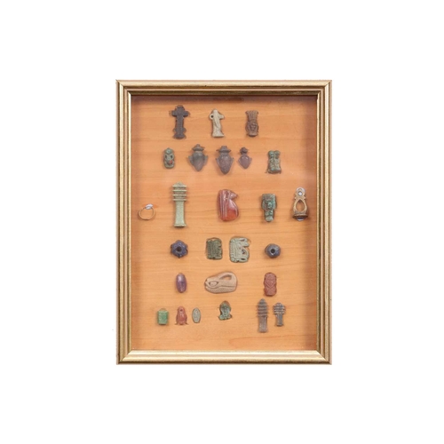 99 - A Collection of Ancient Egyptian artefacts including a bronze Djed pillar amulet, agate Tawaret amul... 