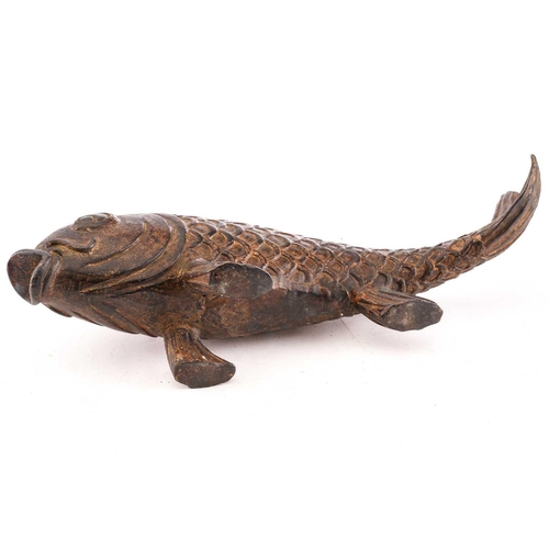 131 - A Chinese bronze carp, the scaley body supported by the pelvis and anal fins, parcel gilt with trace... 