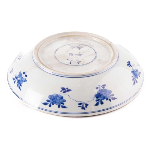 132 - Two Chinese blue & white porcelain chargers, Qing, 18th century and later, each painted with peony, ... 