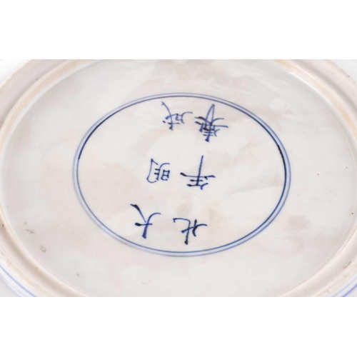 132 - Two Chinese blue & white porcelain chargers, Qing, 18th century and later, each painted with peony, ... 