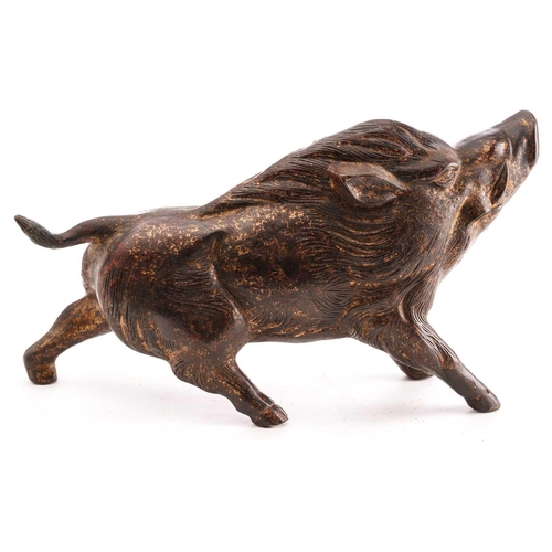 133 - A Chinese bronze figure of a boar, standing on all fours sniffing the air, traces of gilt and red pi... 