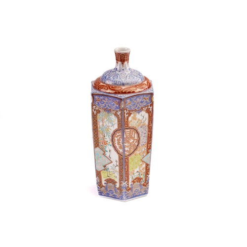 139 - A Japanese Imari porcelain bottle vase, Showa, the panels painted with cranes amongst bamboo, and bl... 