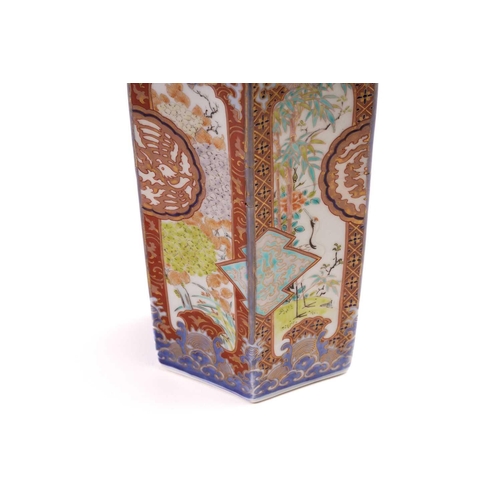 139 - A Japanese Imari porcelain bottle vase, Showa, the panels painted with cranes amongst bamboo, and bl... 