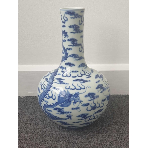 154 - A Chinese blue & white dragon vase, Tianqiuping, painted with two opposing dragons facing a flaming ... 