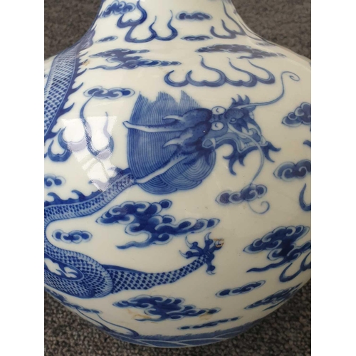 154 - A Chinese blue & white dragon vase, Tianqiuping, painted with two opposing dragons facing a flaming ... 