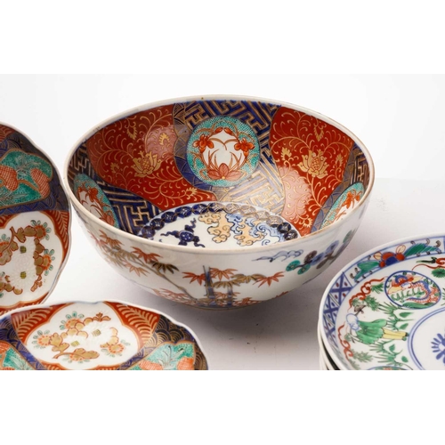 155 - A collection of Japanese imari porcelain, Meiji - Taisho, comprising a large bowl, the exterior pain... 