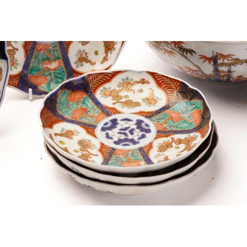 155 - A collection of Japanese imari porcelain, Meiji - Taisho, comprising a large bowl, the exterior pain... 