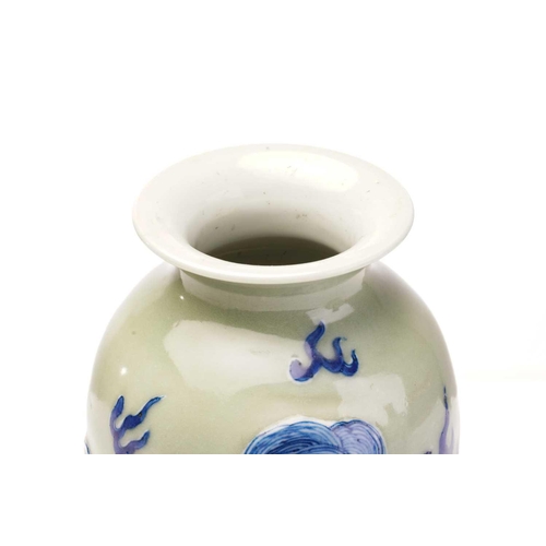 159 - A Chinese celadon porcelain vase,with relief moulded blue and white shi sghi amongst clouds, 24cm; a... 