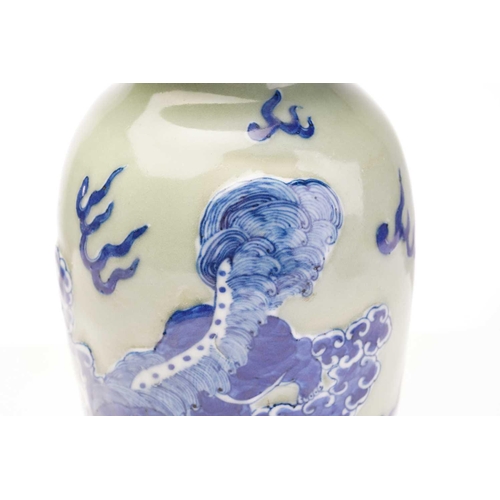 159 - A Chinese celadon porcelain vase,with relief moulded blue and white shi sghi amongst clouds, 24cm; a... 