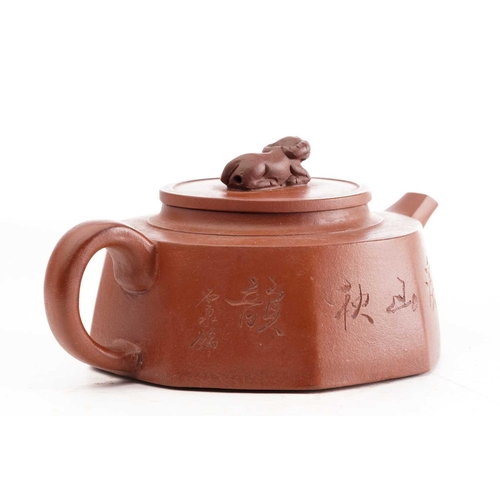 161 - A Chinese yixing octagonal teapot, the knop formed as a recumbent water buffalo, the body incised wi... 