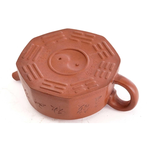 161 - A Chinese yixing octagonal teapot, the knop formed as a recumbent water buffalo, the body incised wi... 