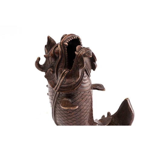 163 - A Chinese bronze censor in the form of a leaping dragon carp, 21cmNo obvious faults.