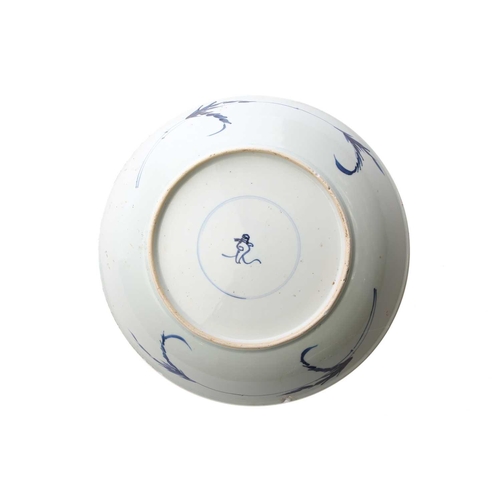 168 - A Chinese blue & white charger, Qing, Kangxi period, the centre painted with flowers within a wanzi ... 