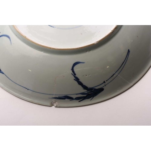 168 - A Chinese blue & white charger, Qing, Kangxi period, the centre painted with flowers within a wanzi ... 