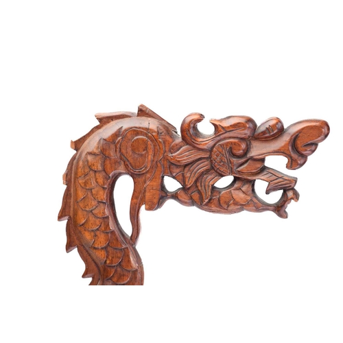 170 - A close pair of Chinese carved wood lantern stands in the form of dragons with turned dome bases and... 