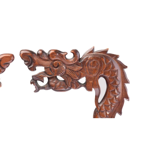 170 - A close pair of Chinese carved wood lantern stands in the form of dragons with turned dome bases and... 