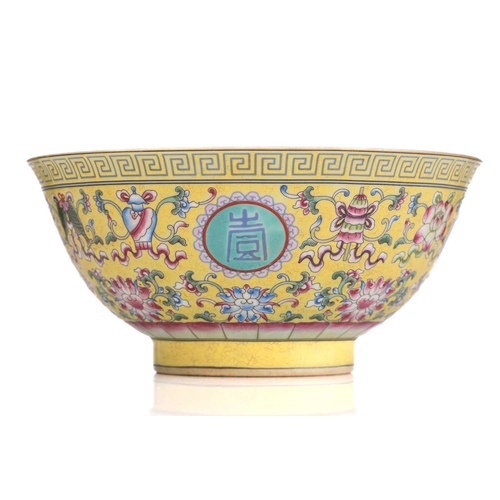 171 - A Chinese porcelain ten thousand blessings bowl, painted with Buddhist symbols on a yellow ground, b... 