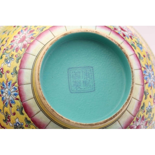 171 - A Chinese porcelain ten thousand blessings bowl, painted with Buddhist symbols on a yellow ground, b... 