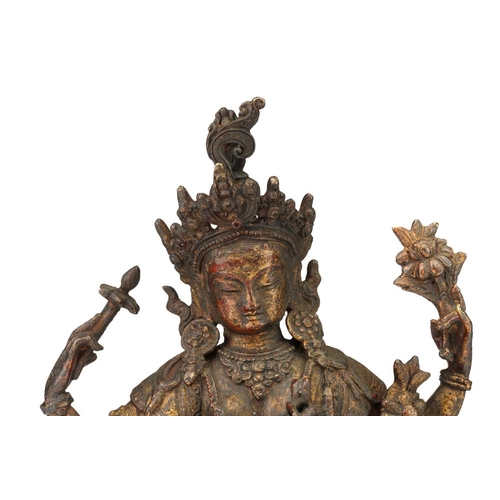 178 - A Chinese Sino Tibetan style bronze Tara, seated in dhyanasana, the six arms with attributes, traces... 