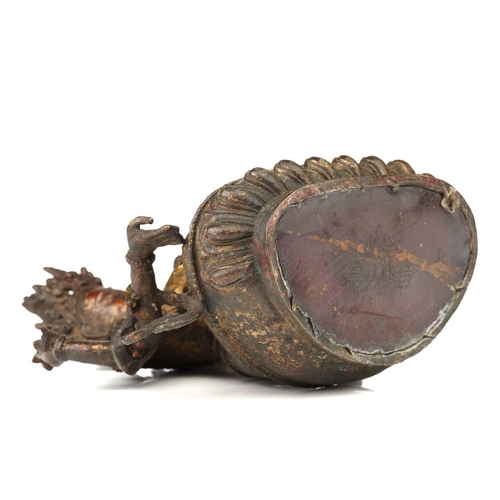 178 - A Chinese Sino Tibetan style bronze Tara, seated in dhyanasana, the six arms with attributes, traces... 