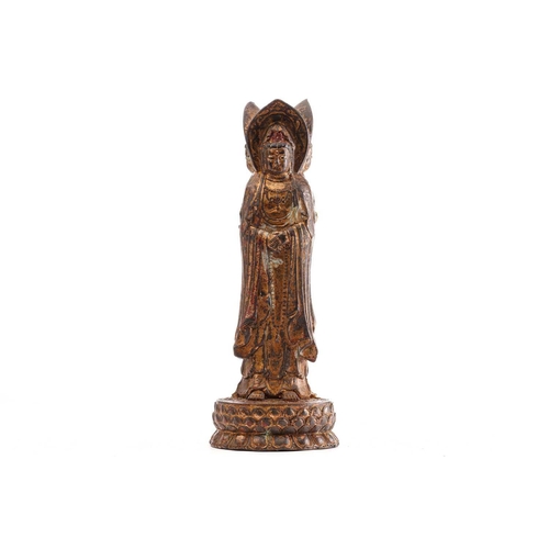 183 - A Chinese bronze figure of the Guanyin of Nanshan, the standing figure dressed in loose robes and je... 