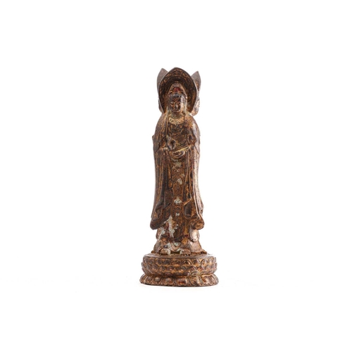 183 - A Chinese bronze figure of the Guanyin of Nanshan, the standing figure dressed in loose robes and je... 