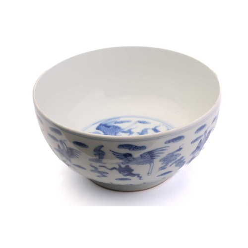 184 - A Chinese porcelain blue & white Cranes bowl, painted with a variety of cranes and bats above spumin... 