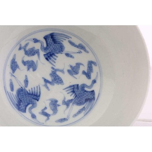 184 - A Chinese porcelain blue & white Cranes bowl, painted with a variety of cranes and bats above spumin... 