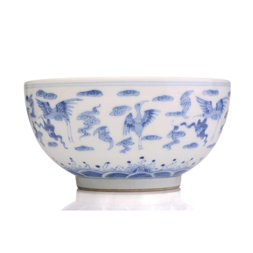 184 - A Chinese porcelain blue & white Cranes bowl, painted with a variety of cranes and bats above spumin... 