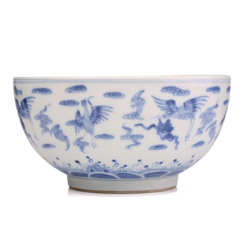 184 - A Chinese porcelain blue & white Cranes bowl, painted with a variety of cranes and bats above spumin... 