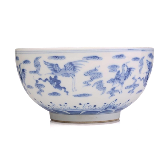 184 - A Chinese porcelain blue & white Cranes bowl, painted with a variety of cranes and bats above spumin... 