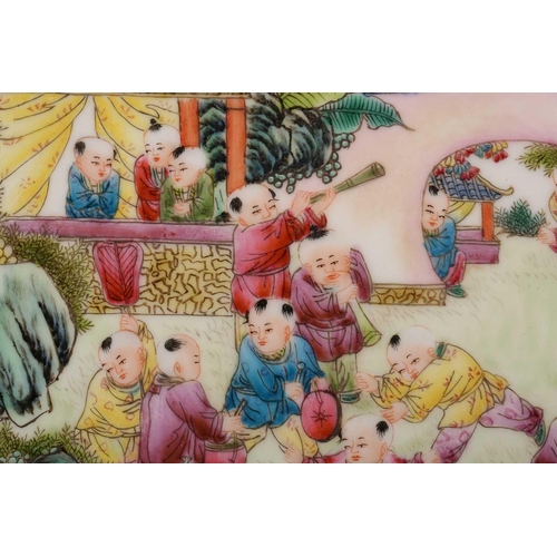 186 - A Chinese porcelain famille rose boys dish, painted with numerous boys at play within a walled garde... 