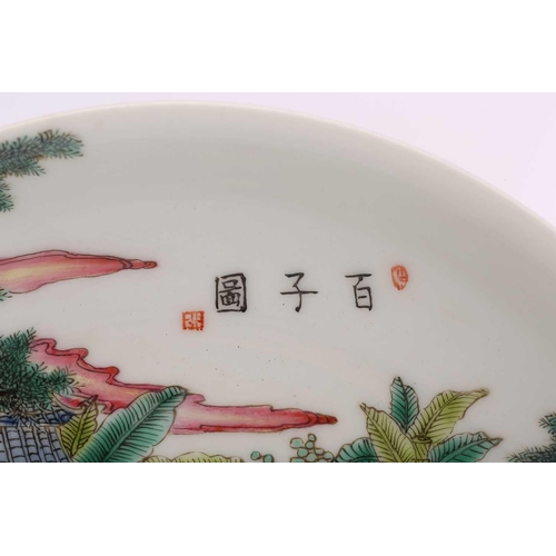 186 - A Chinese porcelain famille rose boys dish, painted with numerous boys at play within a walled garde... 