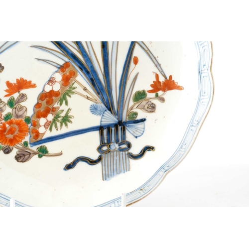 188 - A set of seven Japanese Arita plates, late 19th century, painted with flowers and leaves with butter... 