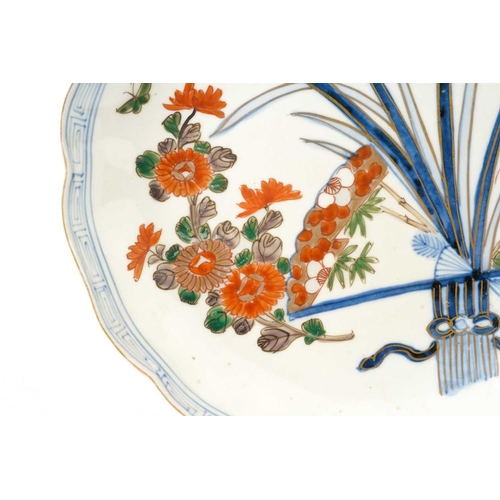 188 - A set of seven Japanese Arita plates, late 19th century, painted with flowers and leaves with butter... 