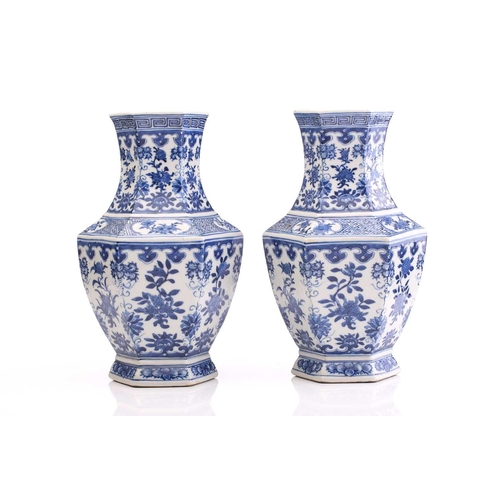 190 - A pair of Chinese blue & white vases, Qing, 19th century, of hexagonal form, painted with panels of ... 