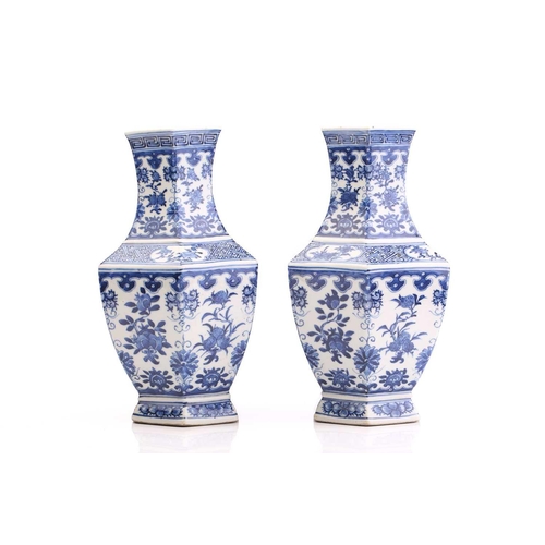 190 - A pair of Chinese blue & white vases, Qing, 19th century, of hexagonal form, painted with panels of ... 