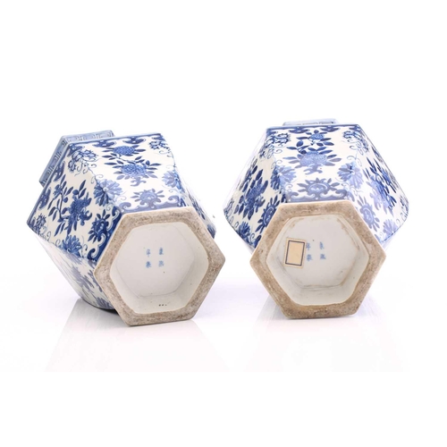 190 - A pair of Chinese blue & white vases, Qing, 19th century, of hexagonal form, painted with panels of ... 