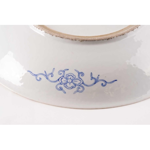 191 - A Chinese porcelain millefleur charger with two red dragons, late Qing /early Republic Period, the d... 