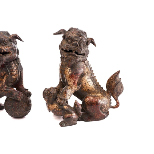 194 - A pair of Chinese bronze censors in the form of temple lions, seated on their haunches, the heads hi... 