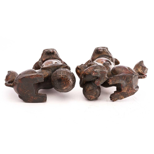 194 - A pair of Chinese bronze censors in the form of temple lions, seated on their haunches, the heads hi... 