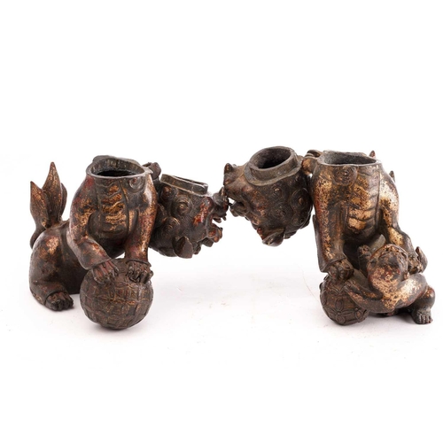 194 - A pair of Chinese bronze censors in the form of temple lions, seated on their haunches, the heads hi... 