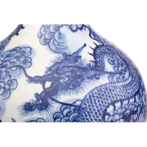 197 - A Chinese porcelain tianqiuping dragon vase, painted with s writhing dragon chasing a pearl through ... 