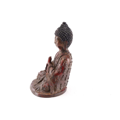 201 - A Chinese bronze figure of Samantabhadra Buddha, the loose robes with relief cast luohan, traces of ... 