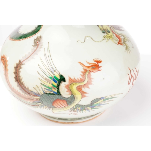 203 - A Chinese porcelain tianqiuping dragon and fenghuang vase, painted amongst fiery clouds, between a b... 